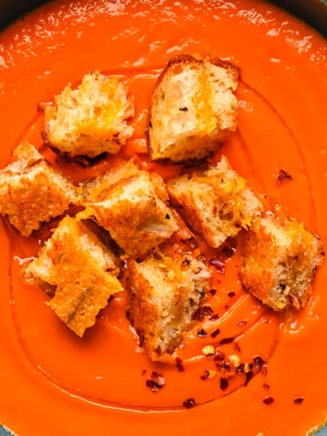 Overhead view of soup with croutons.