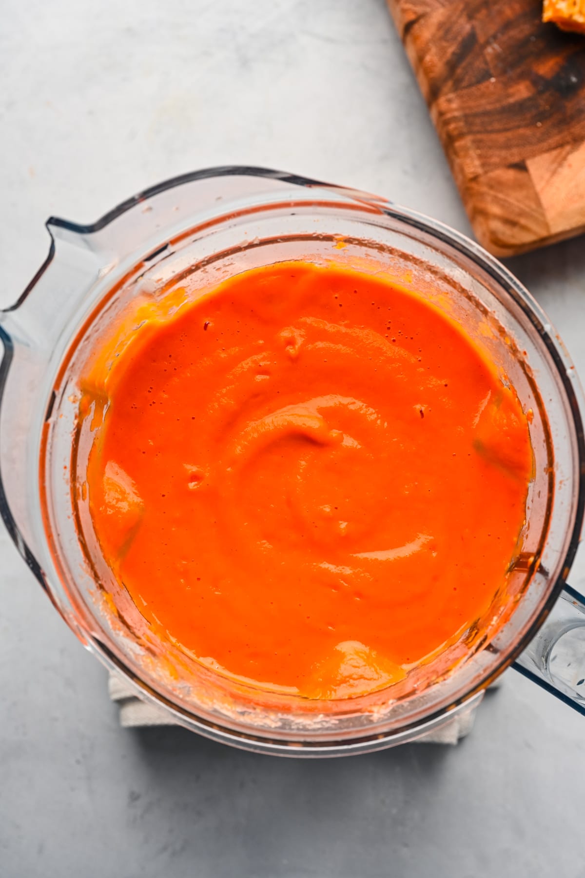 Overhead view of soup in a blender.