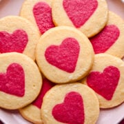 Overhead view of cookies on a pink plate.