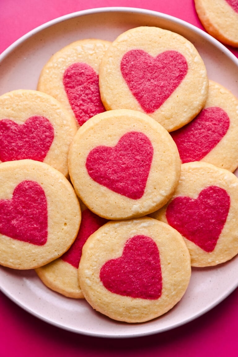 Soft sugar cookies with pink heart designs, perfect for Valentine's Day.