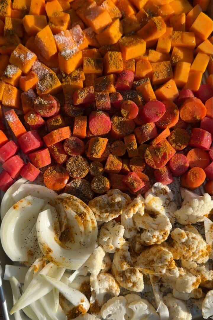 Overhead view of vegetables on a sheet pan.