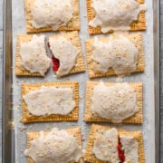 Overhead view of finished pop tarts on a sheet pan.