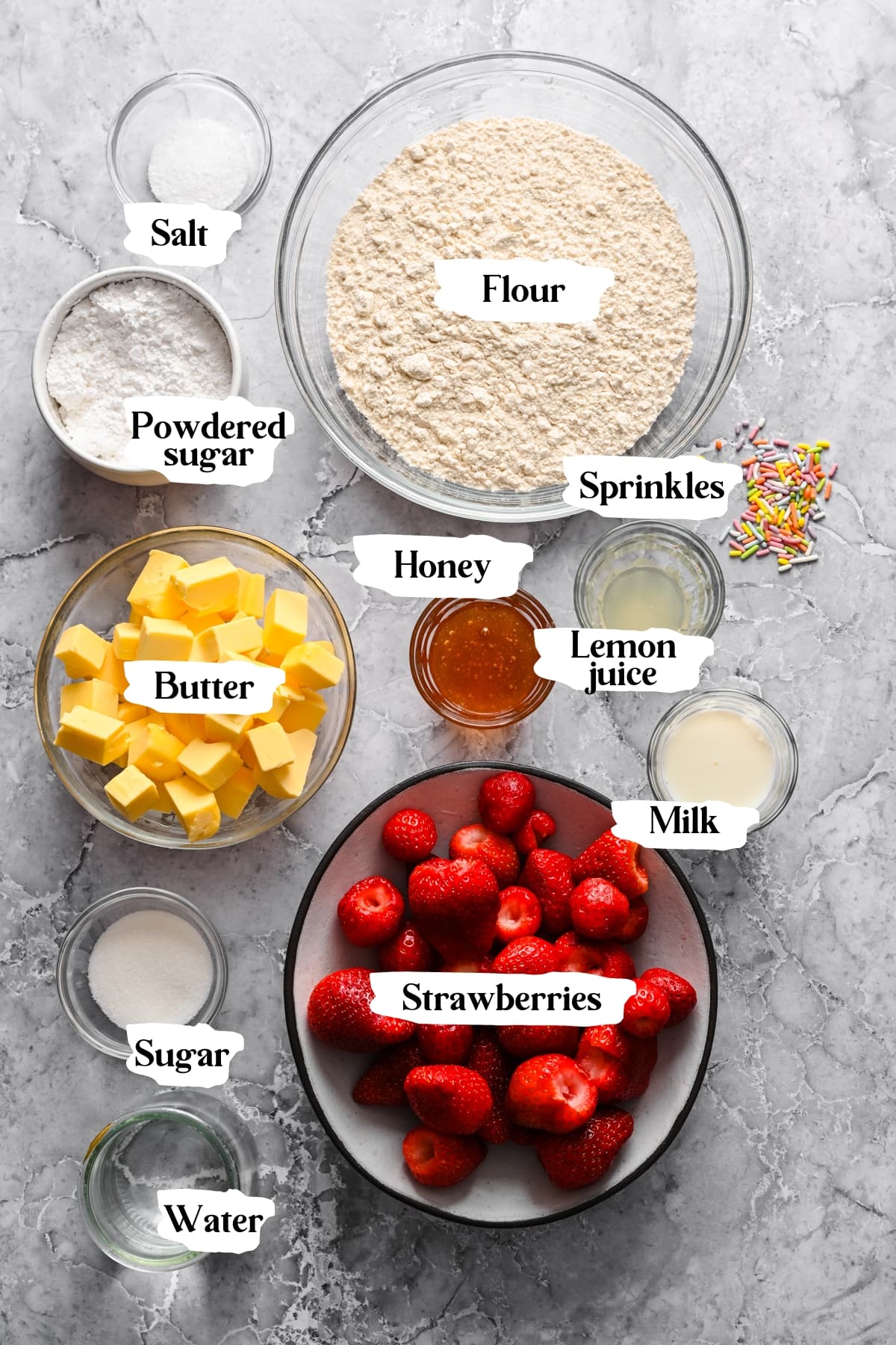 Overhead view of strawberry pop tart ingredients, including butter and strawberries.