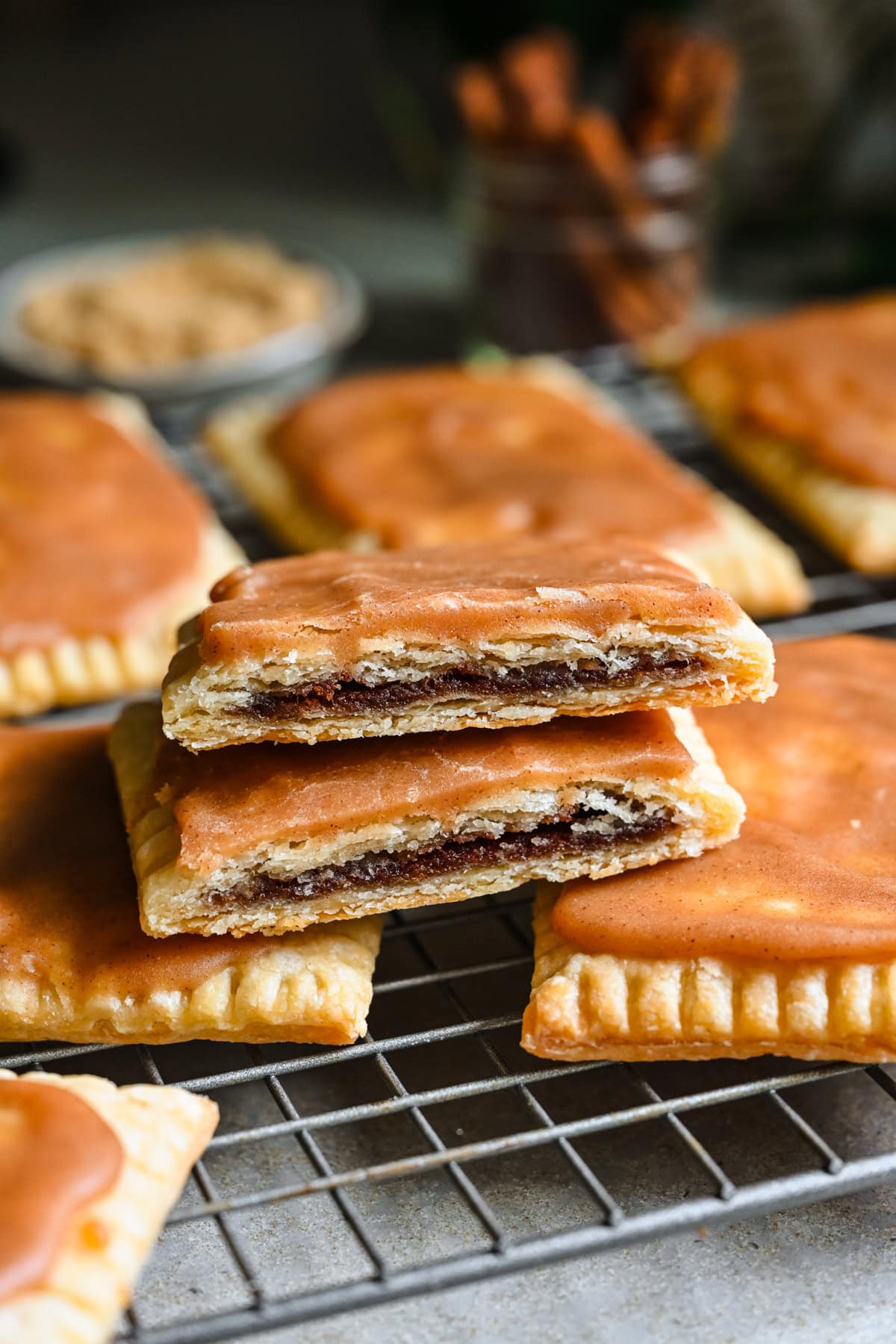 Front view of brown sugar cinnamon pop tarts on a cooling rack.