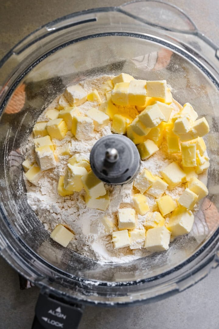 Overhead view of butter in a food processor.