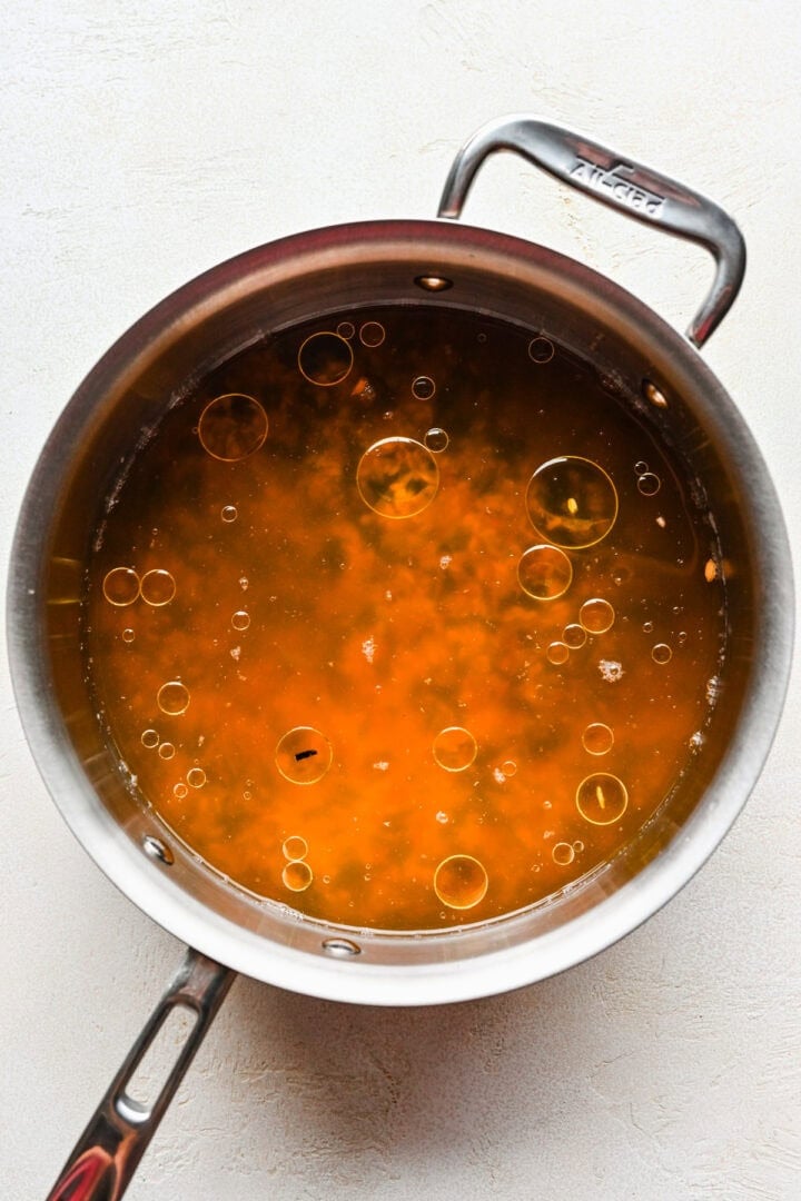 Overhead view of uncooked wild rice in a pot.