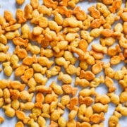 Crispy salted corn nuts on parchment paper colorful snack.