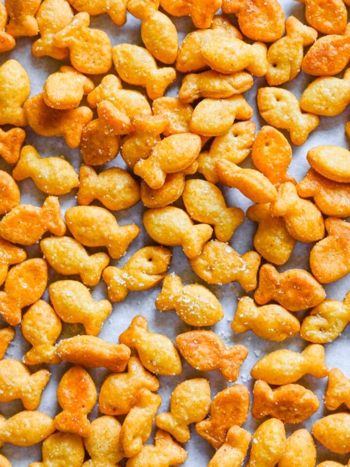 Overhead view of goldfish on parchment paper.