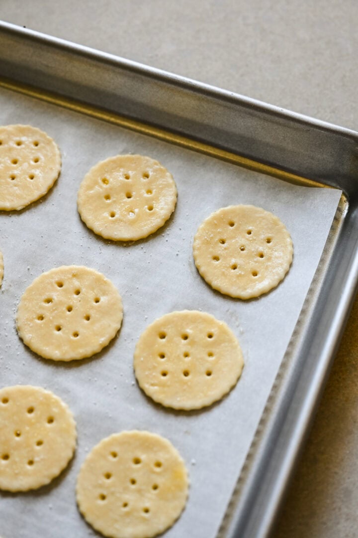 Crackers on a sheet pan before going into the oven.