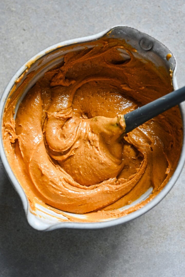 Overhead view of peanut butter and sugar mixture in a bowl.