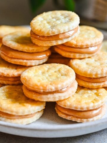 Front view of peanut butter sandwiches on a plate.