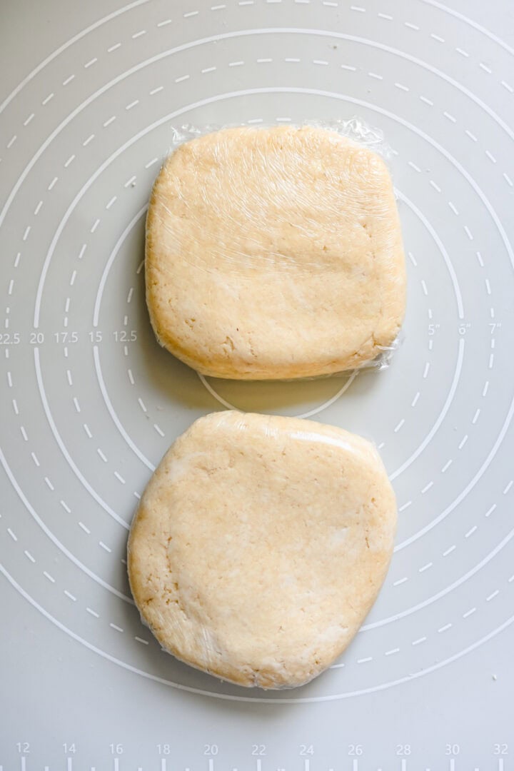 Cracker dough divided in half and wrapped in plastic.