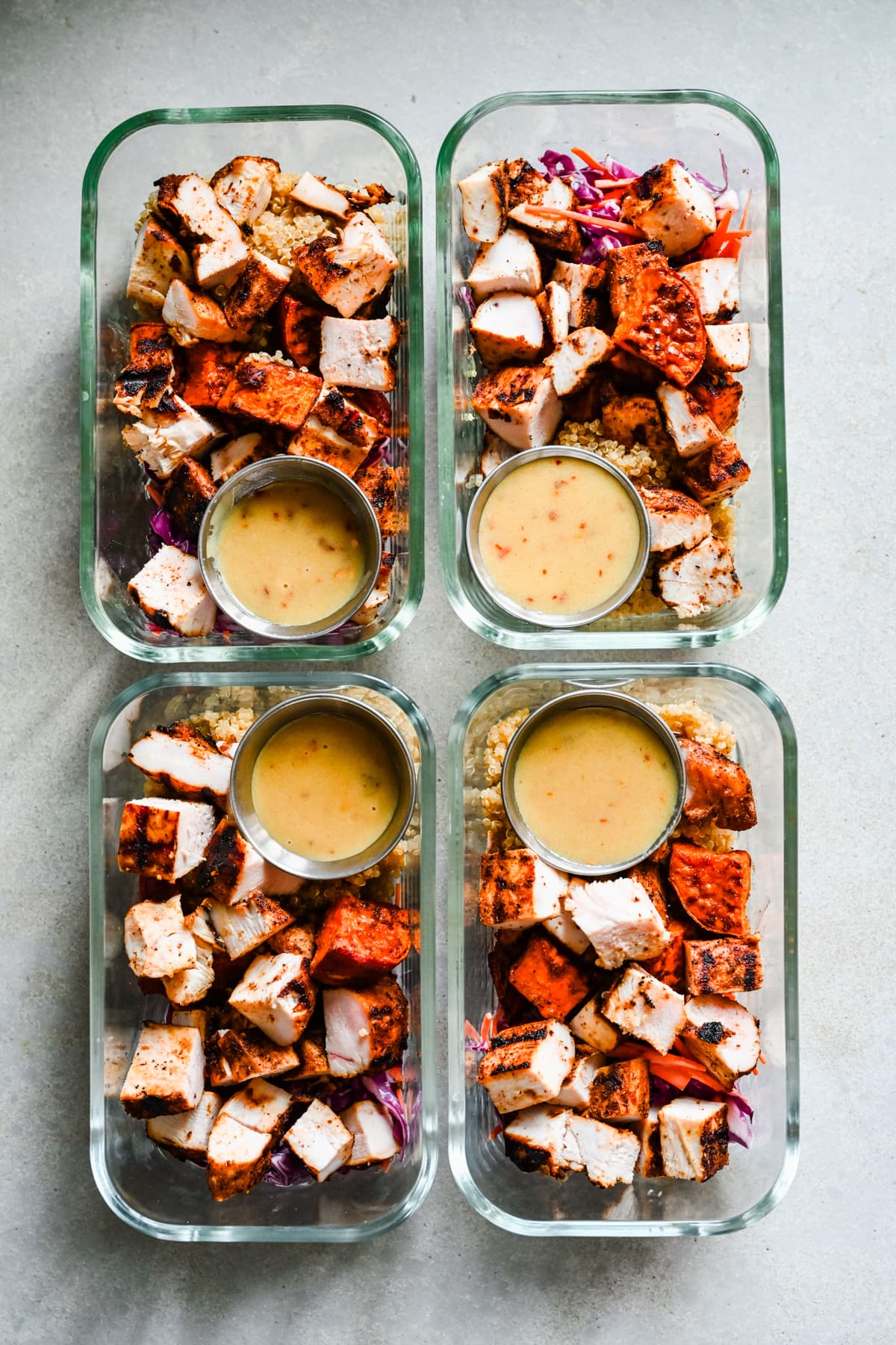 hot honey chicken bowls in meal prep containers.
