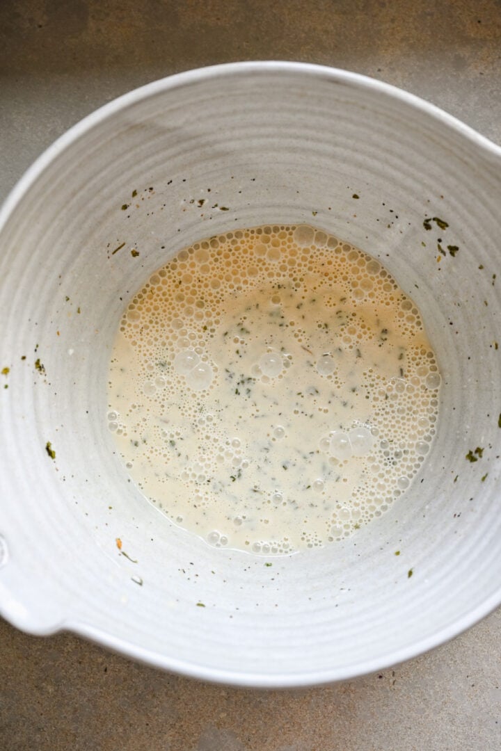 Slaw base in a bowl after whisking.