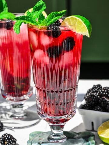 close up side view of blackberry mojito.