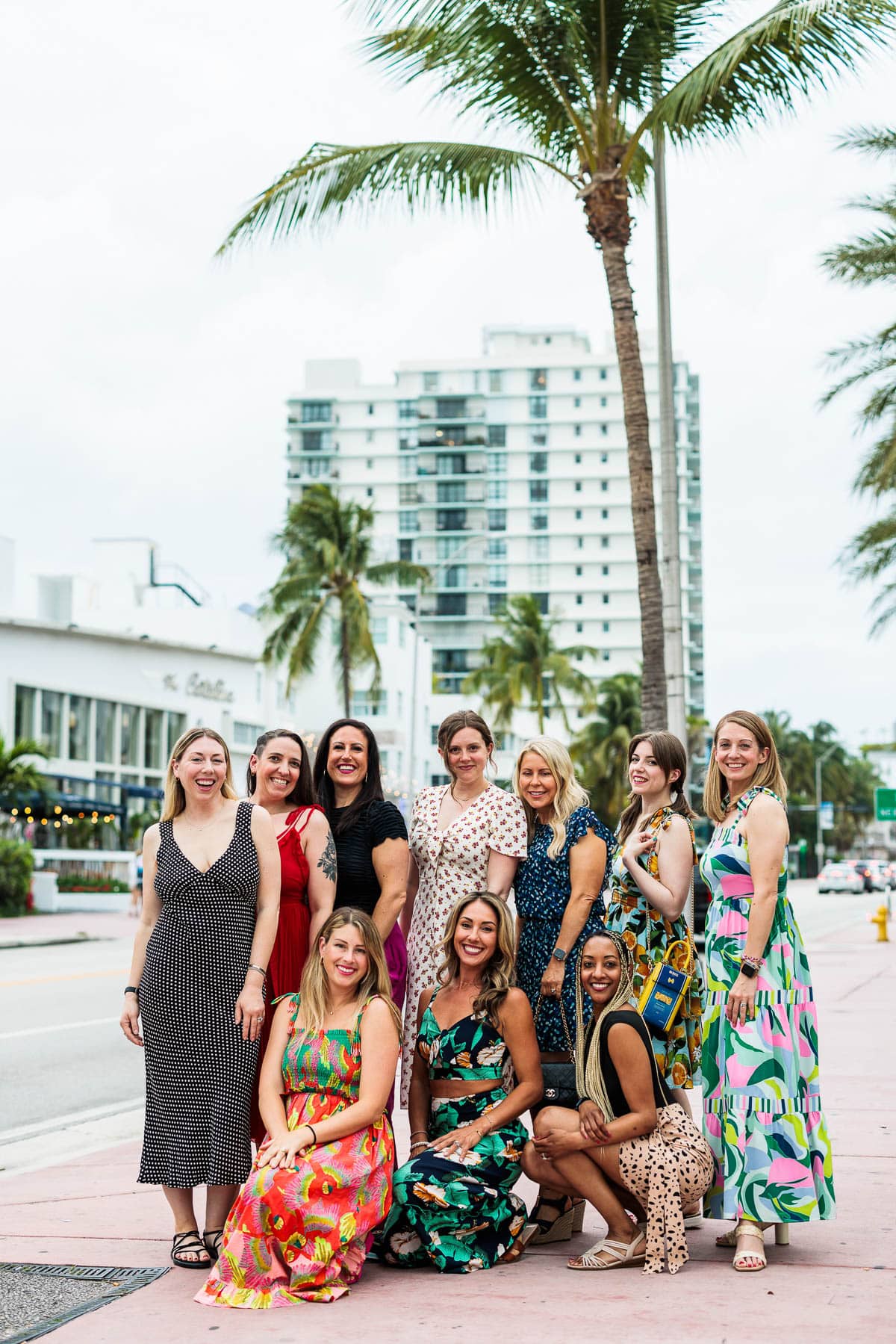 Side view of a group of women standing on street.