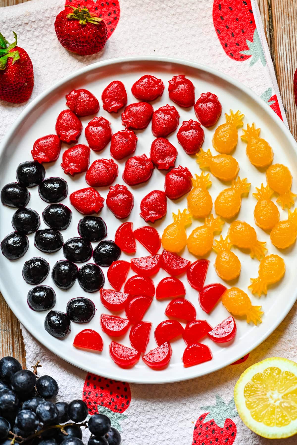 Plate full of fruit snacks of different varieties.