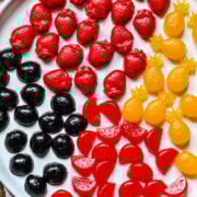 Plate full of fruit snacks of different varieties.