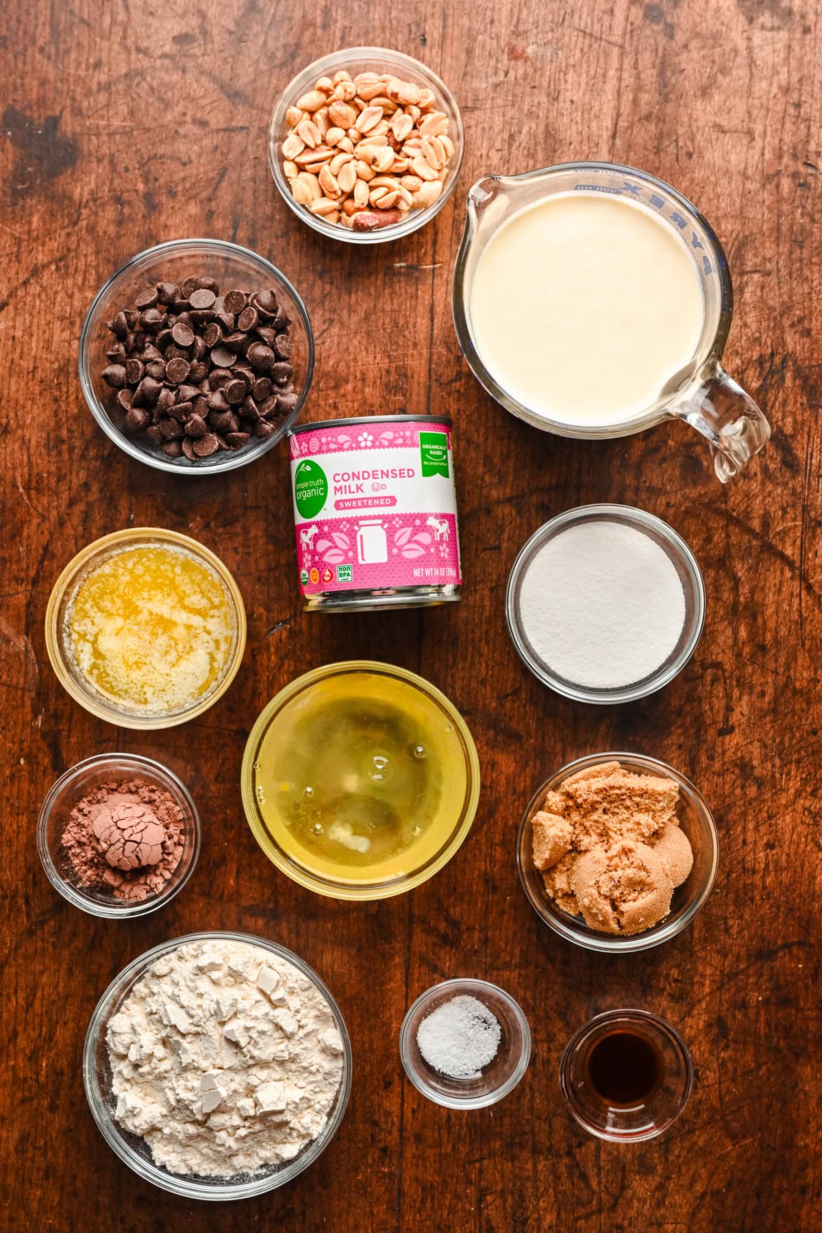 Overhead view of choco taco ingredients, including condensed milk and cocoa powder.
