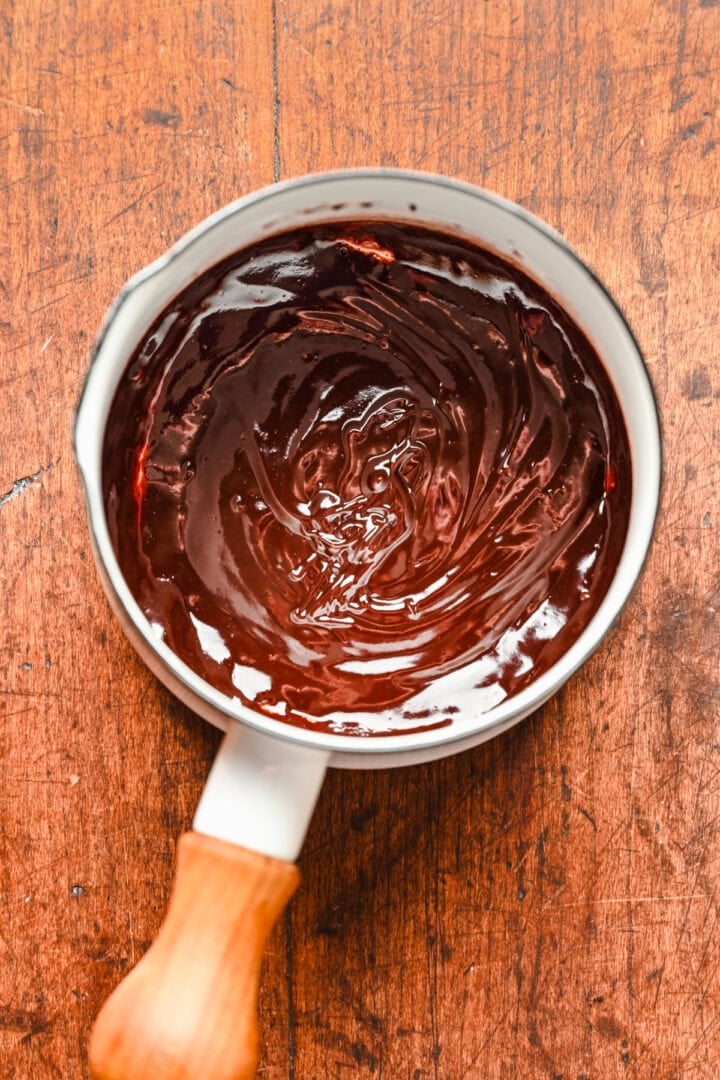 Overhead view of fudge sauce in a saucepan.