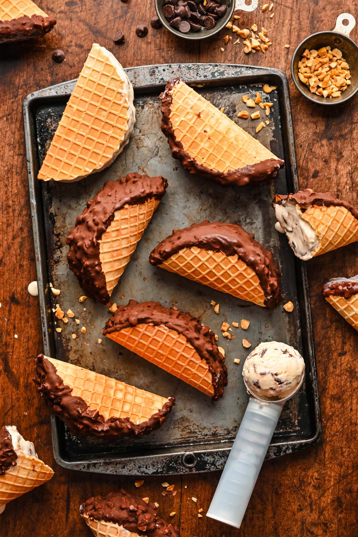 Overhead view of finished choco tacos on a rustic sheet pan.