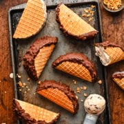 Overhead view of finished choco tacos on a rustic sheet pan.