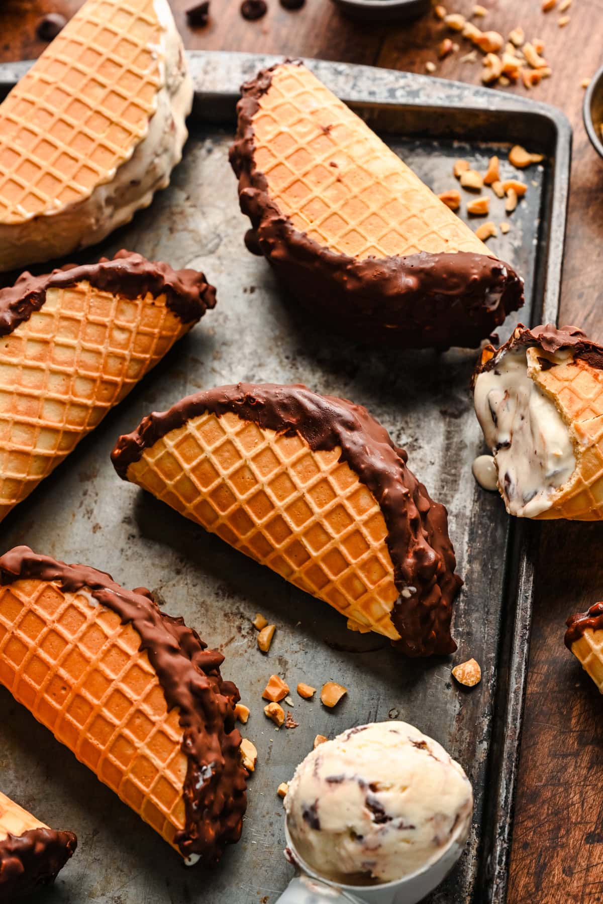 Overhead view of finished choco tacos on a rustic sheet pan.