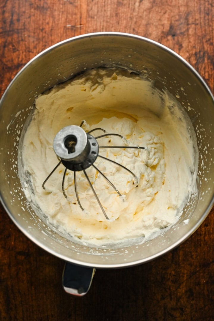 Whipped heavy cream in a bowl.