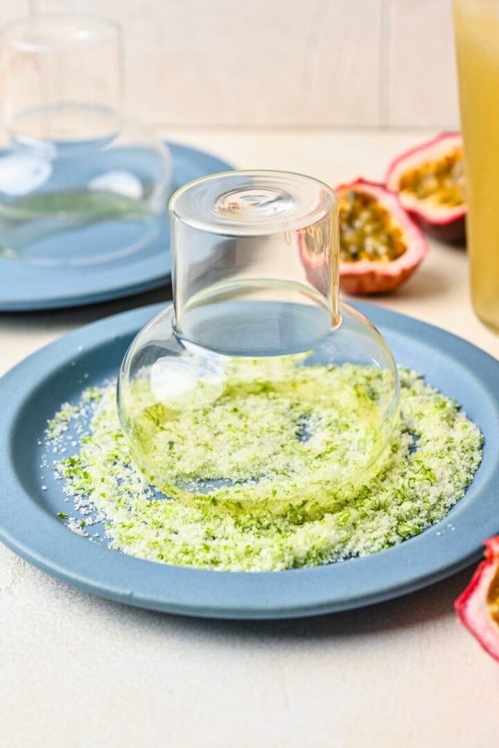 Rimming glass with zest mixture.