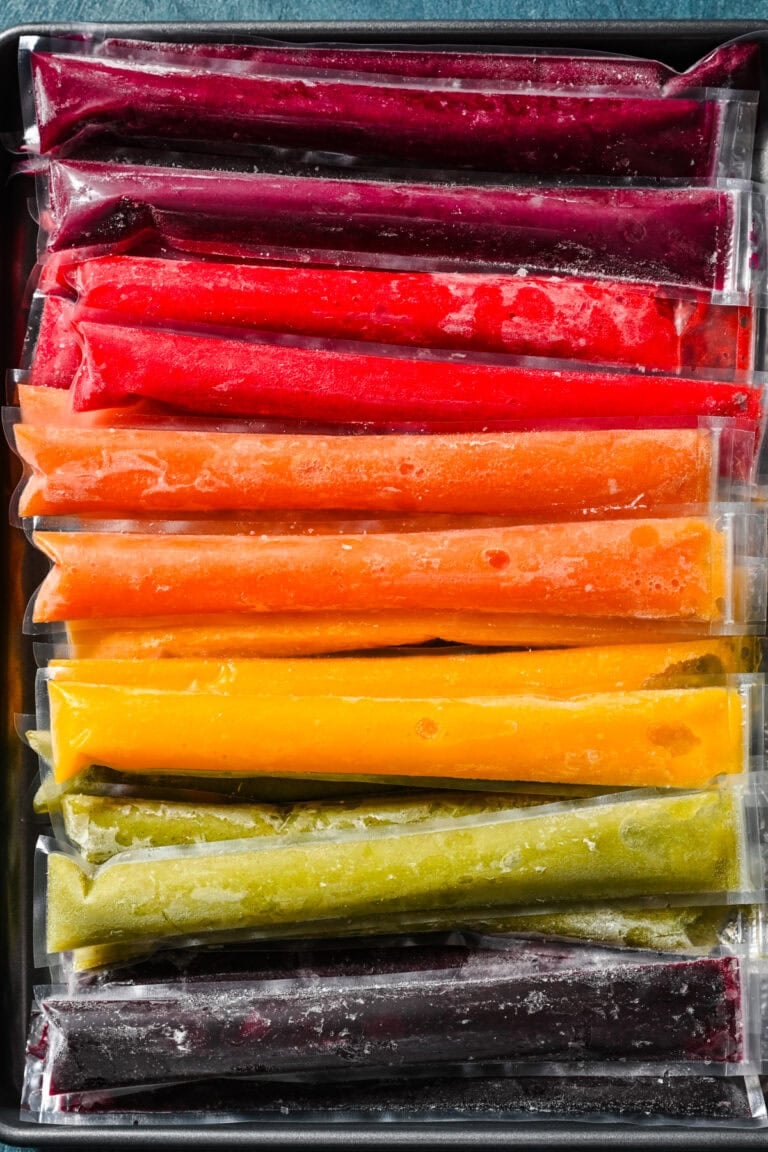 Frozen colorful fruit bars, vibrant summer treat, ready to enjoy.