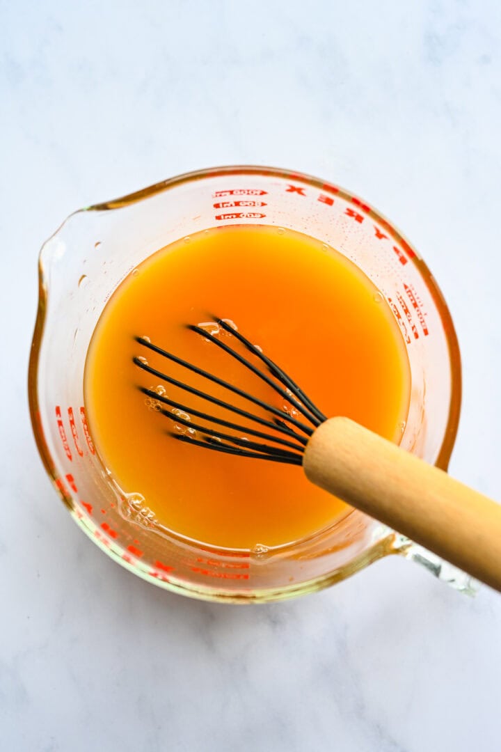 Overhead view of orange ingredients mixed together.