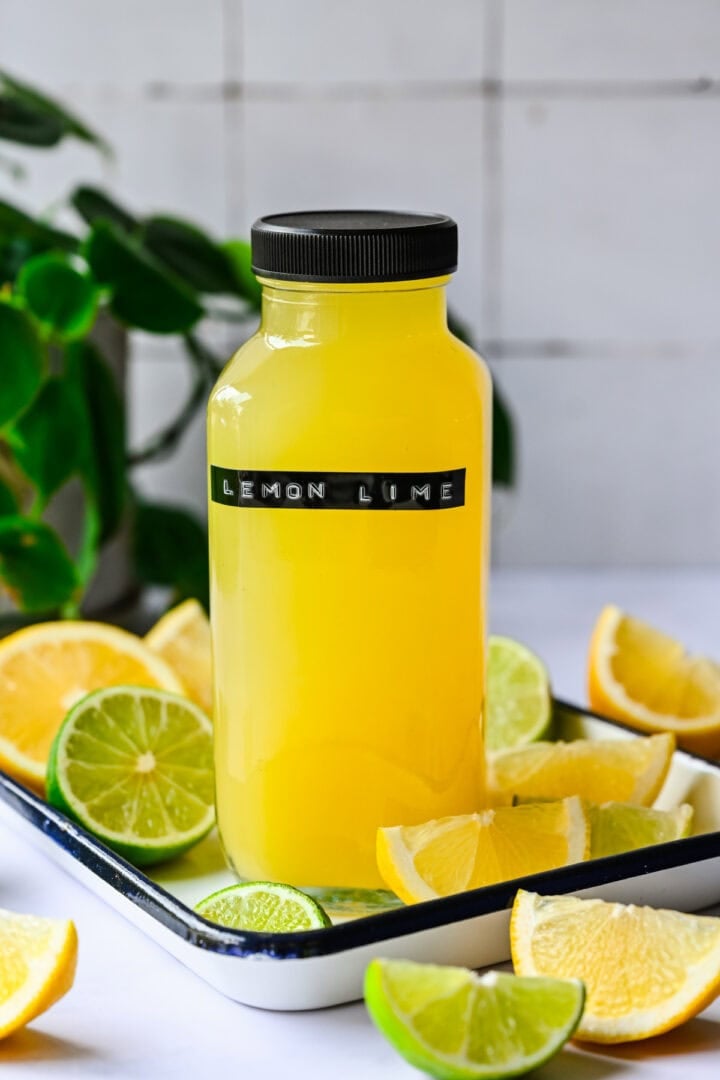 Front view of lemon lime gatorade in a glass bottle.