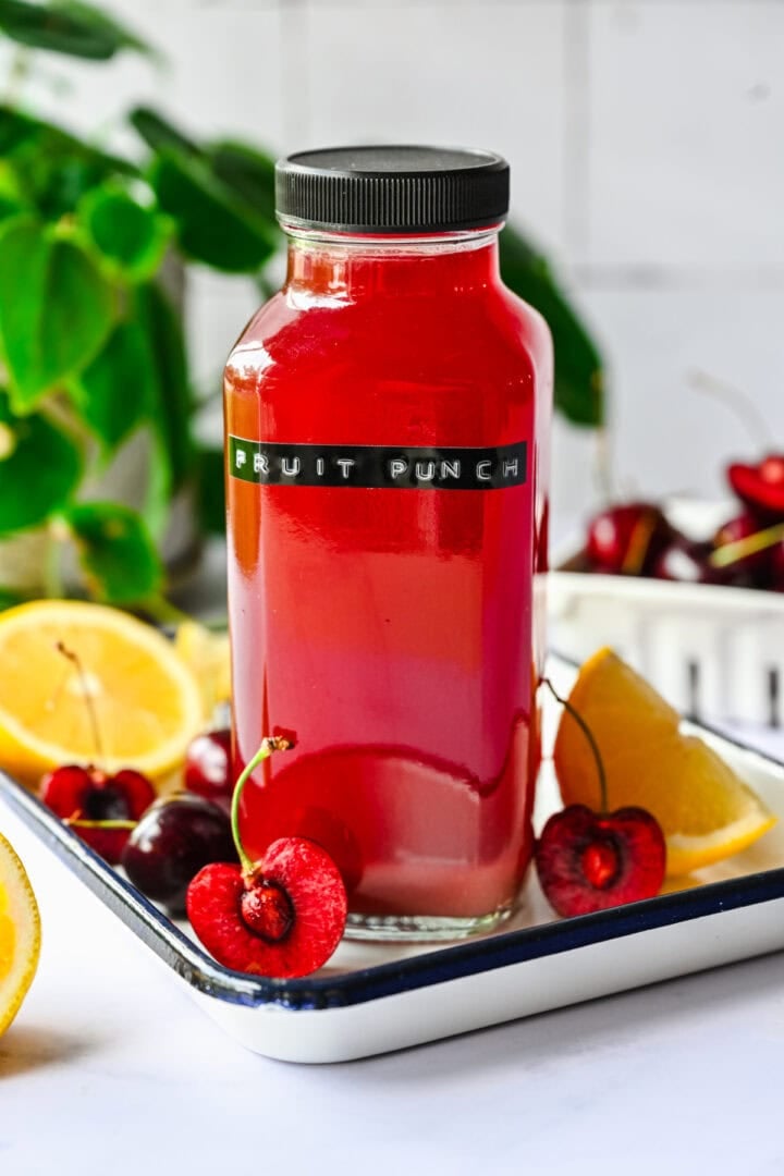 Front view of fruit punch gatorade in a glass bottle.