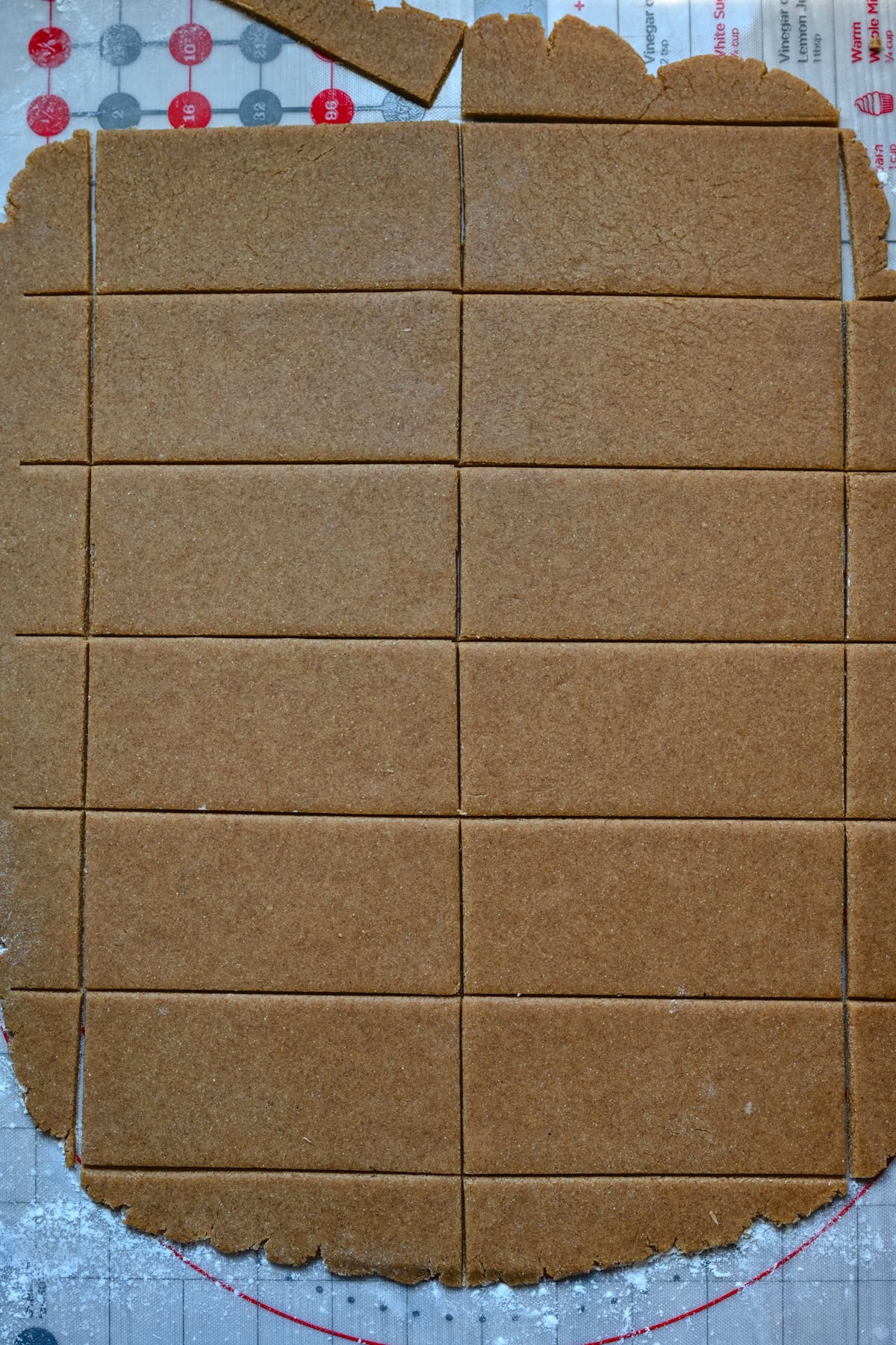 Graham cracker dough rolled out and cut into shape.