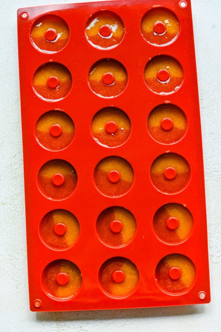 Peach rings in a silicone mold before drying.