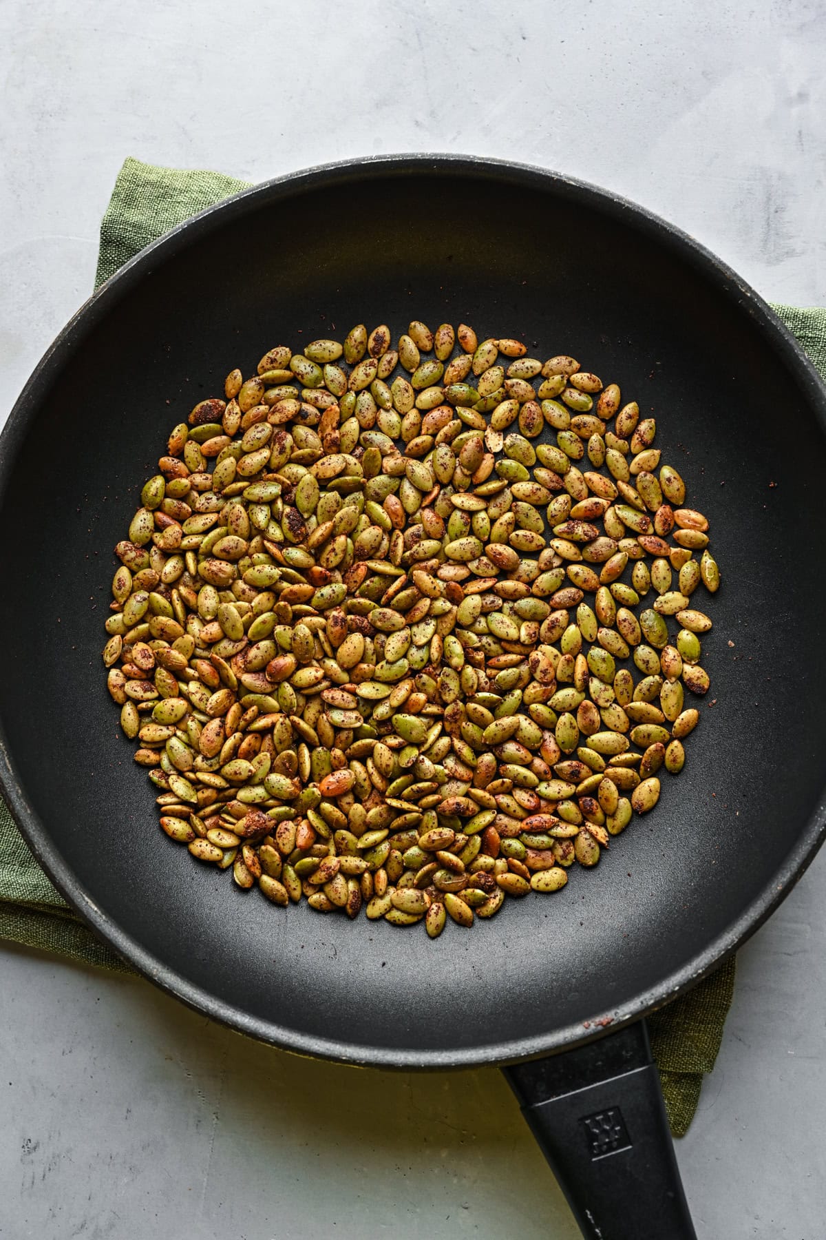 Nuts toasting in a pan.