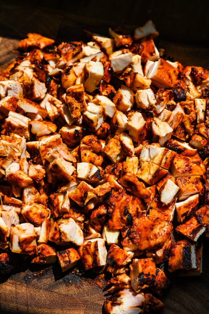 Overhead view of chopped chicken thighs.