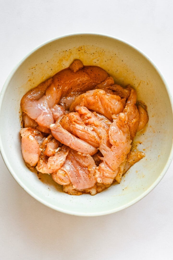 Chicken tenders in a bowl.