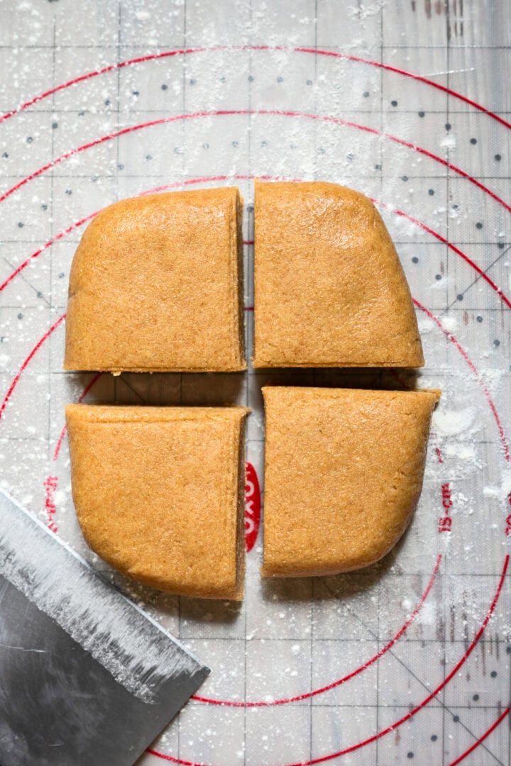 Dough divided into four pieces.