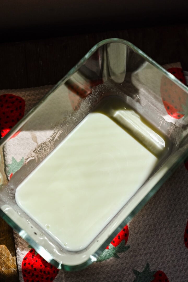 Mixing in yogurt with milk.