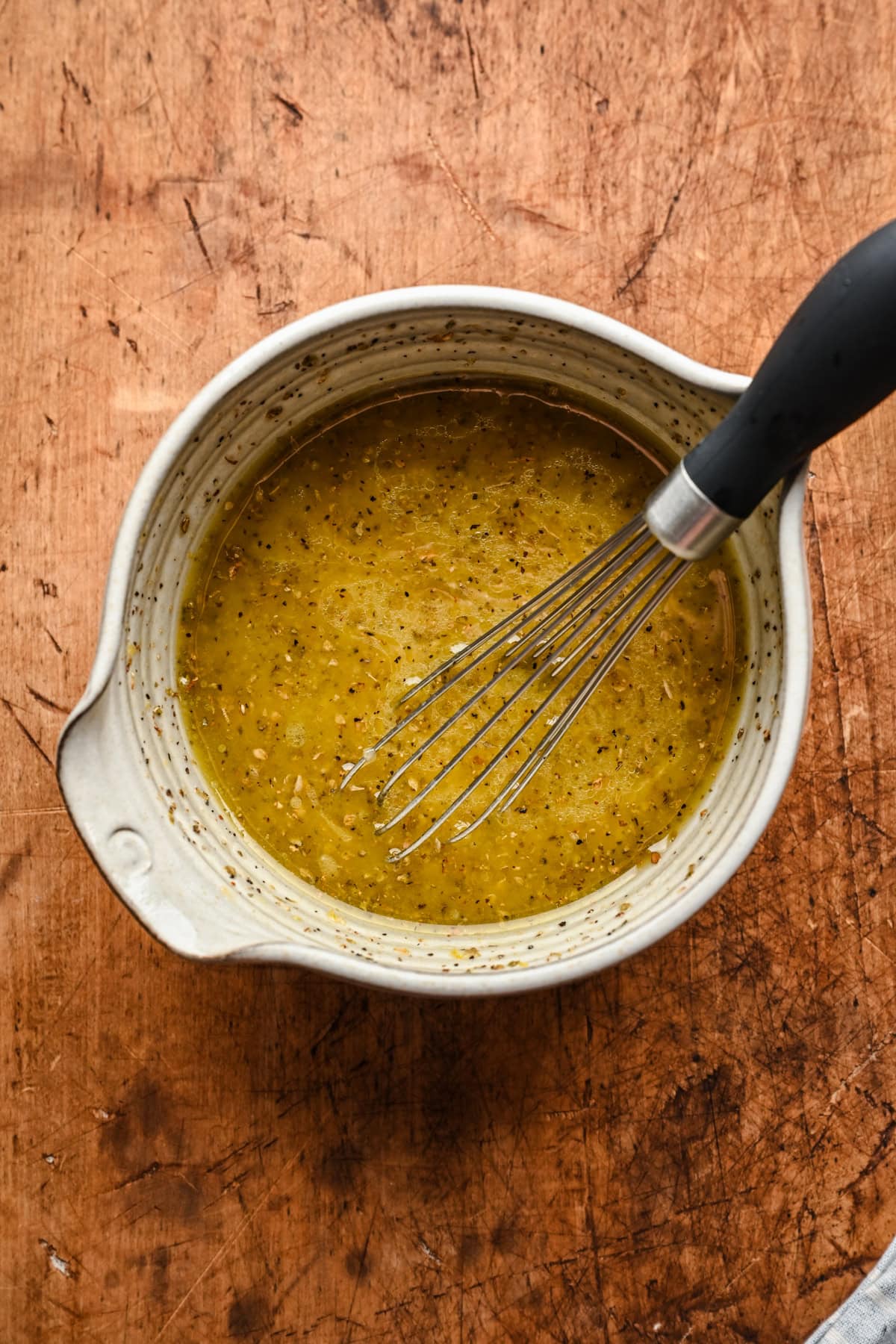 overhead view of lemon vinaigrette in a bowl.