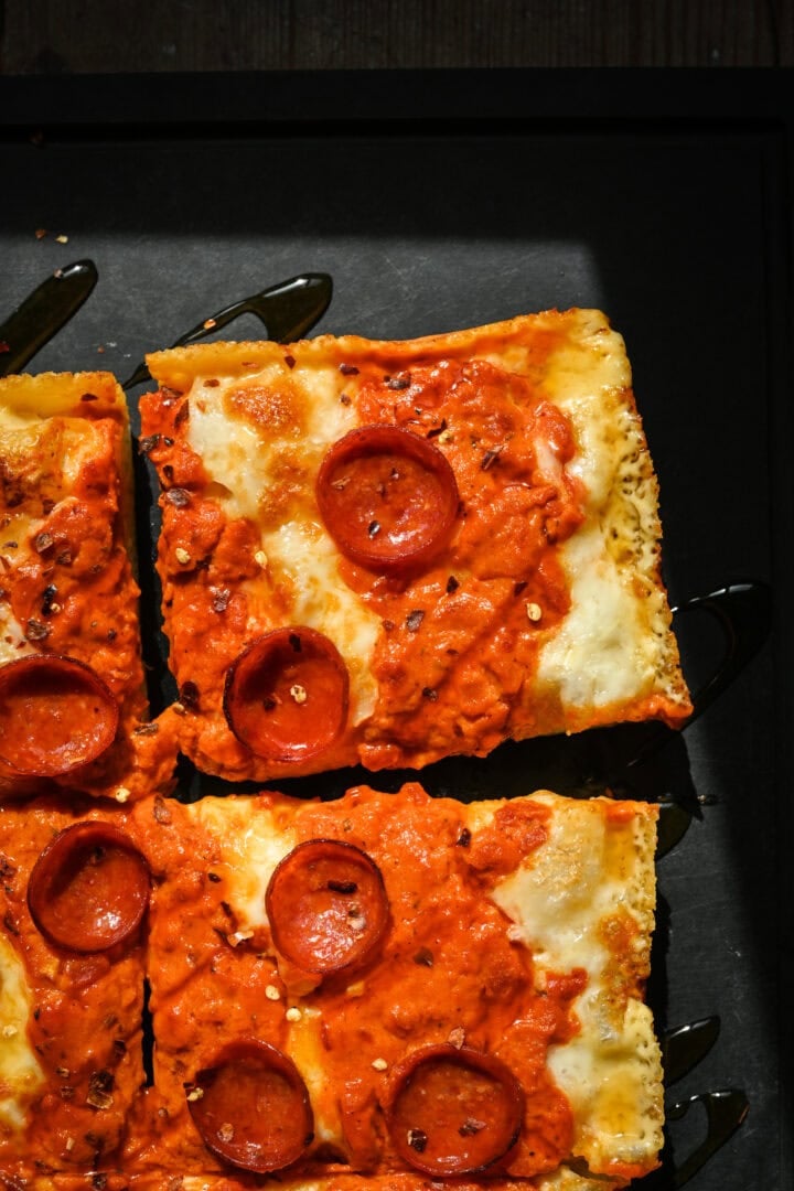Overhead view of corner of pizza.
