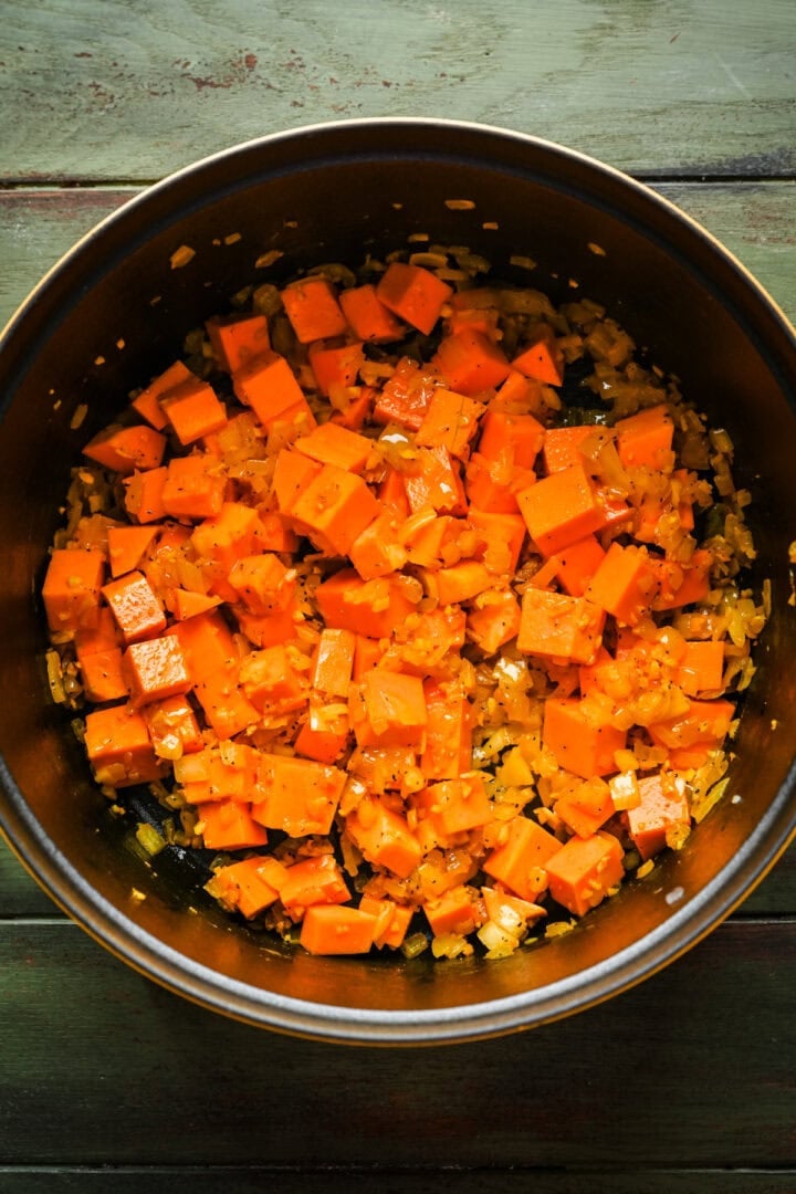 Butternut squash cooking in a dutch oven.