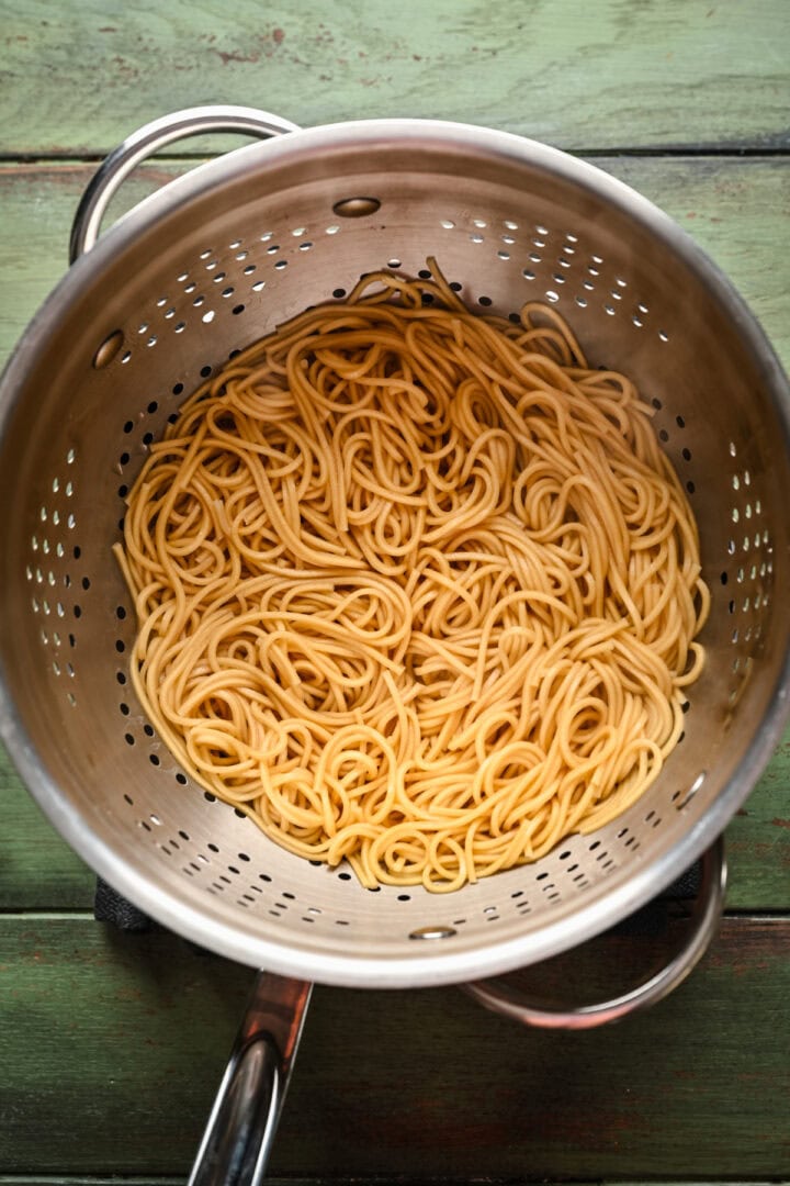 Noodles in a colander after cooking.