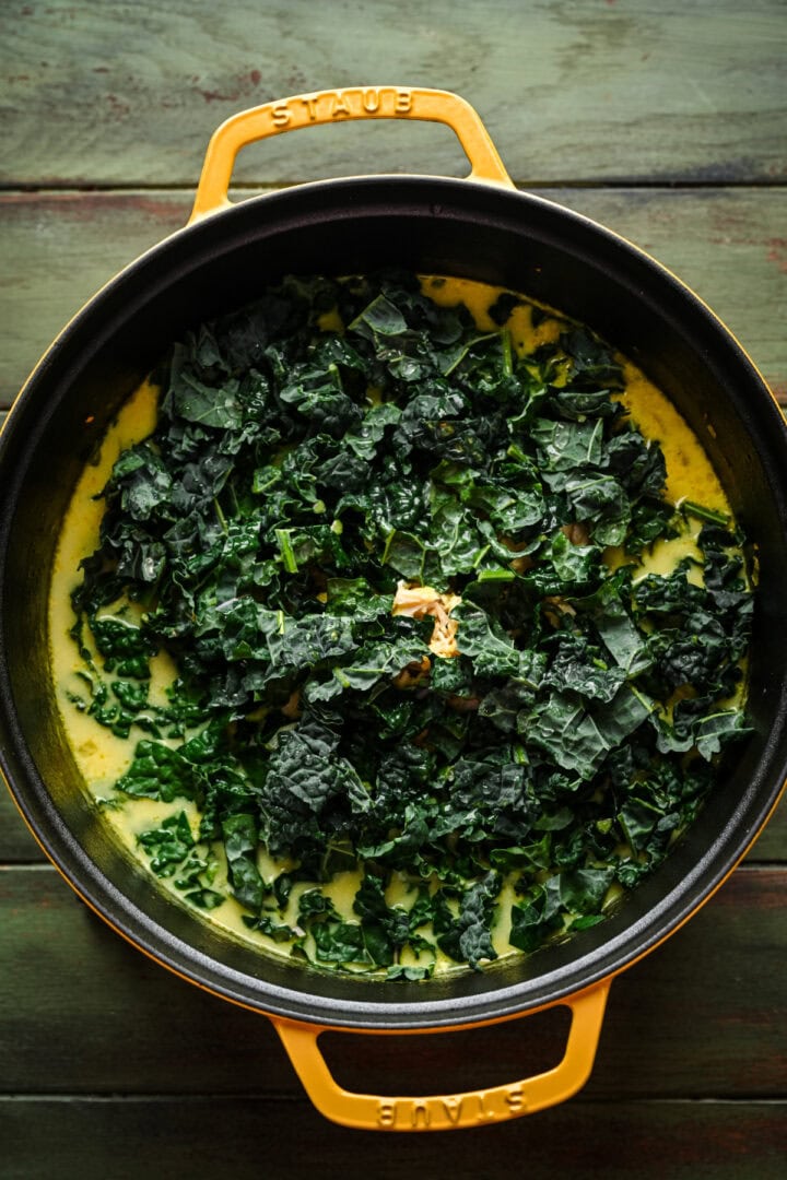 Soup after adding kale to pot.