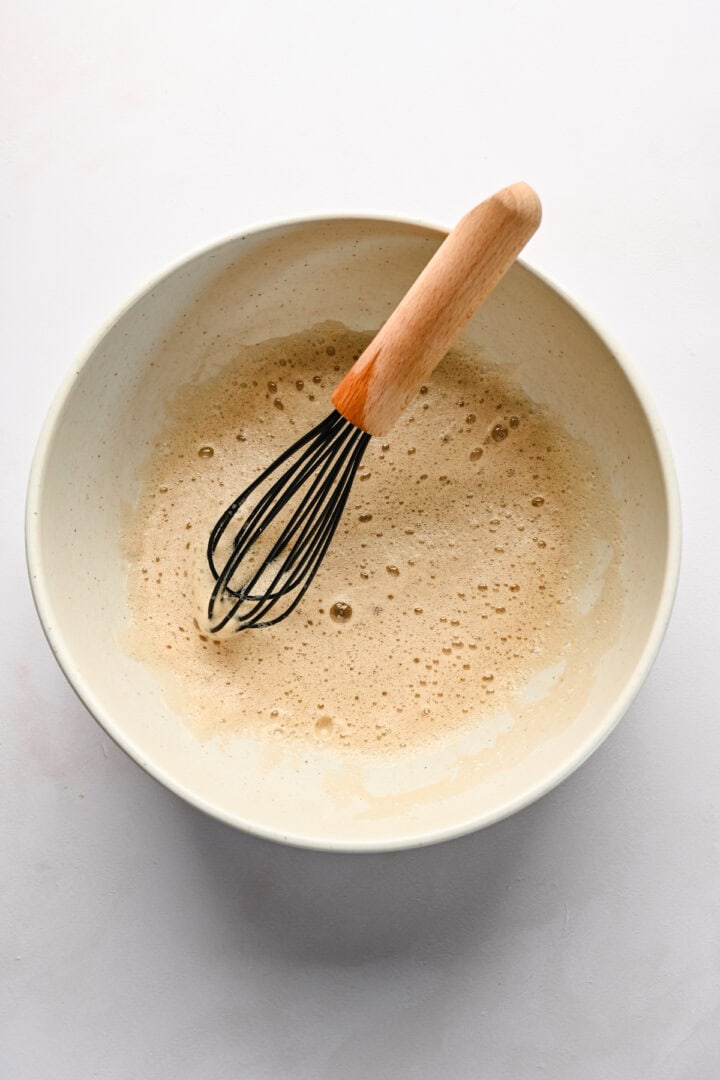 Overhead view of dry and wet ingredients after being whisked together.