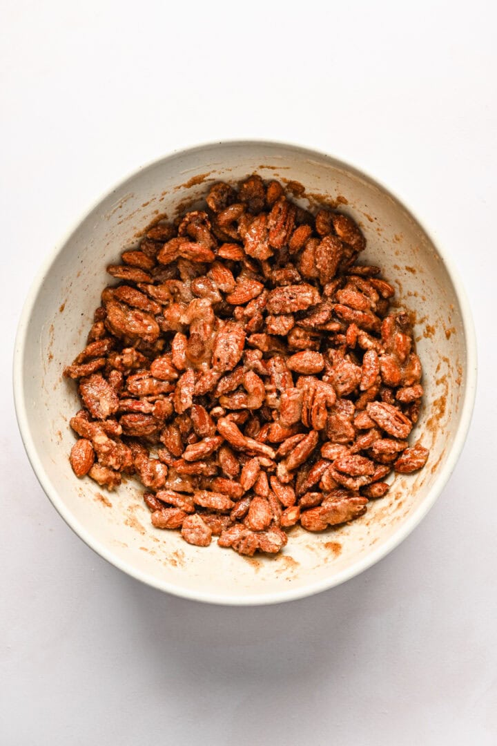 Overhead view of pecans after being mixed with coating.