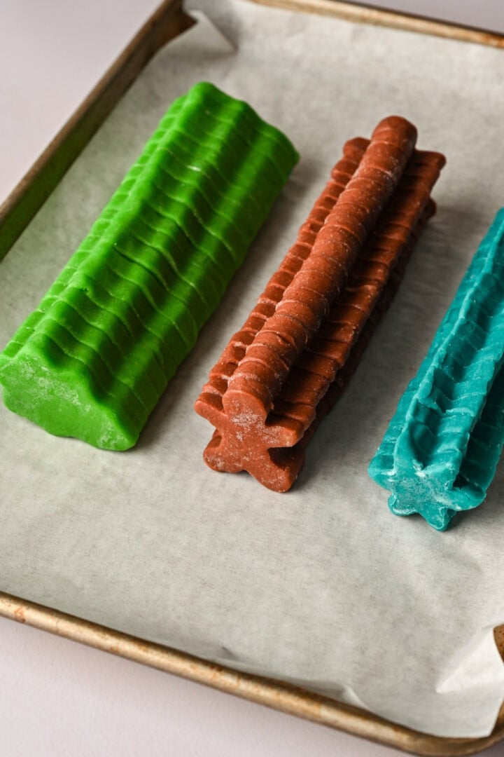 "Logs" of stacked shapes on a sheet pan.