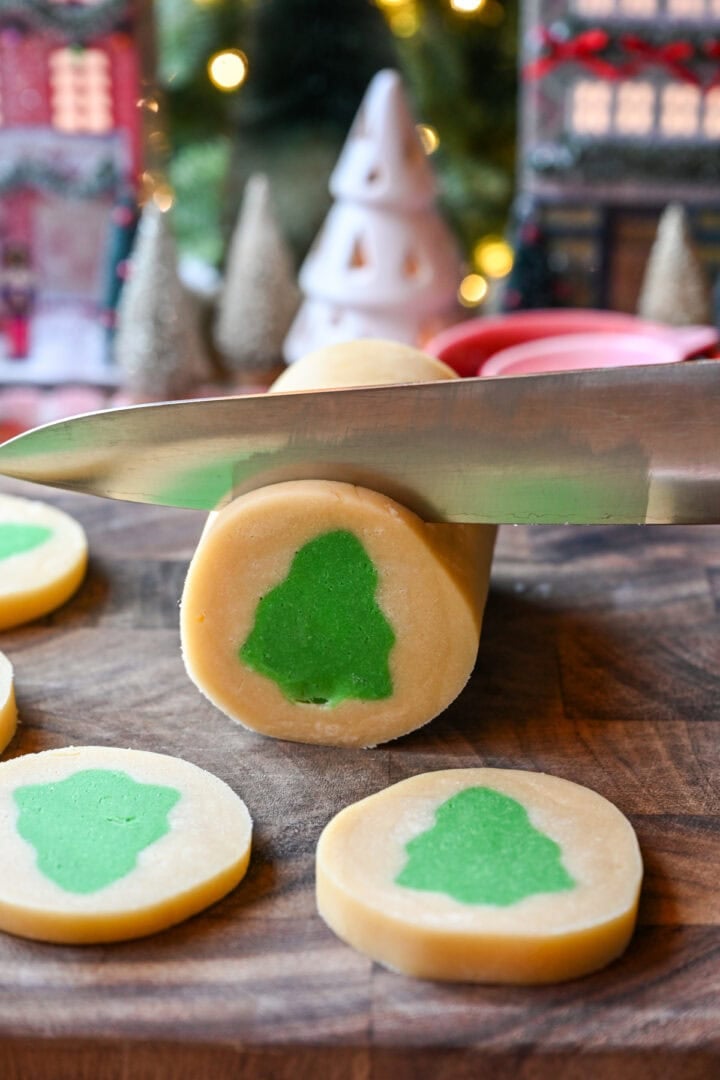 Slicing into green christmas tree log.