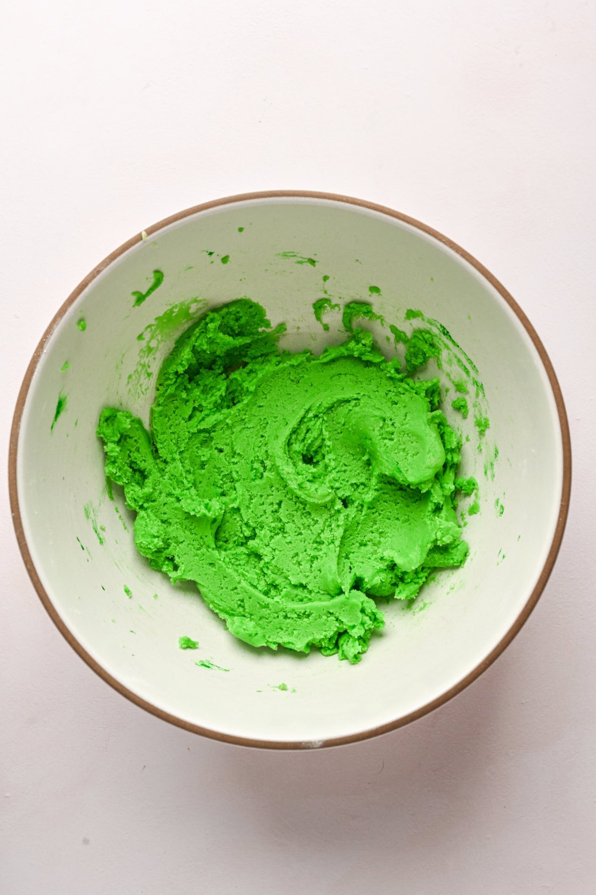 Green dough in a bowl.